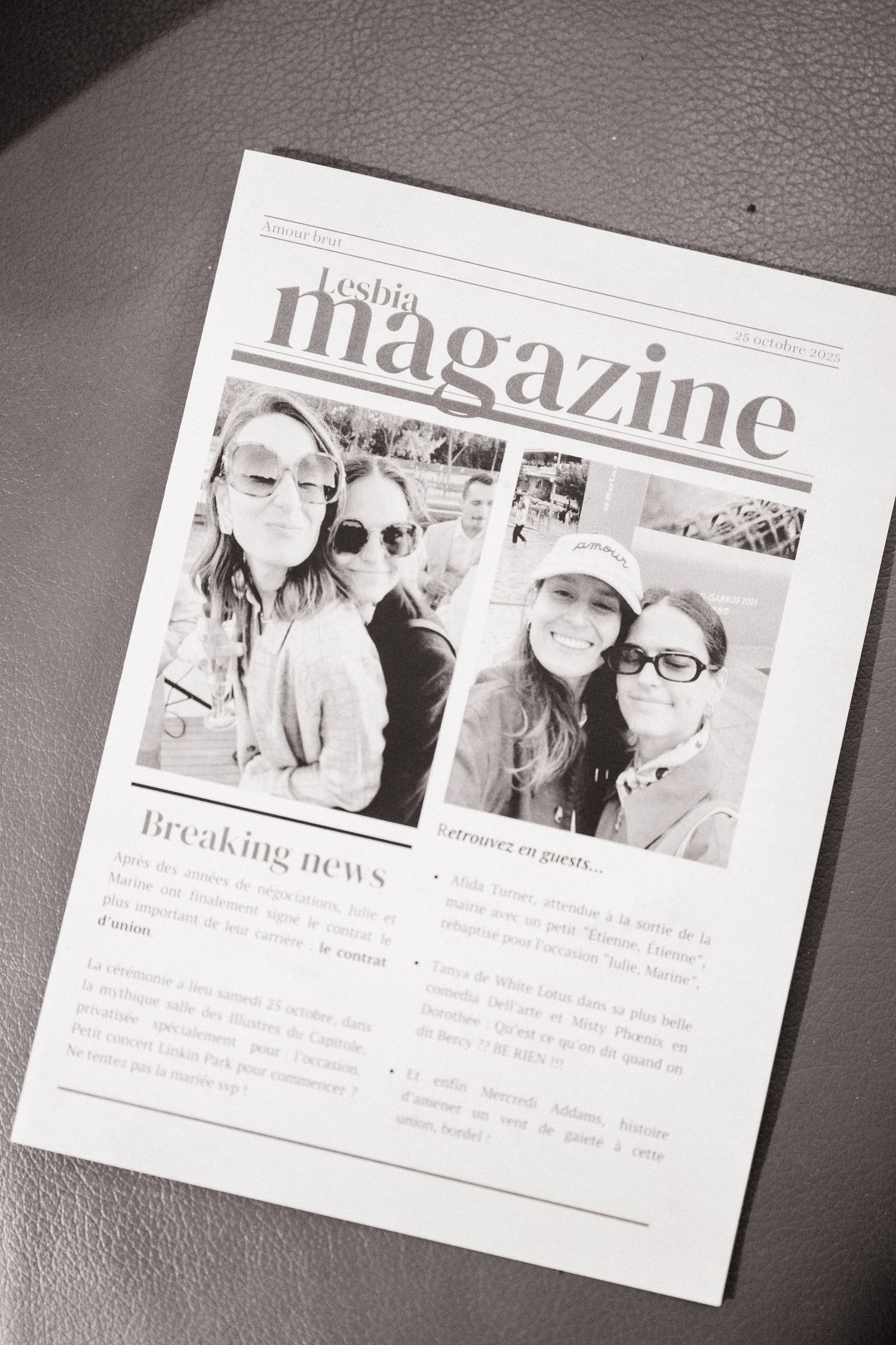 Black and white printed lesbian magazine featuring two women in sunglasses on the cover with breaking news section.