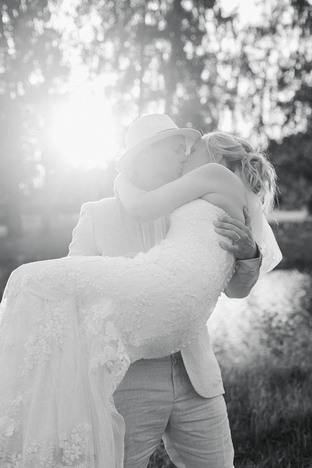 A romantic black and white photo sequence shows a couple in formal attire dancing and dipping in an outdoor setting.