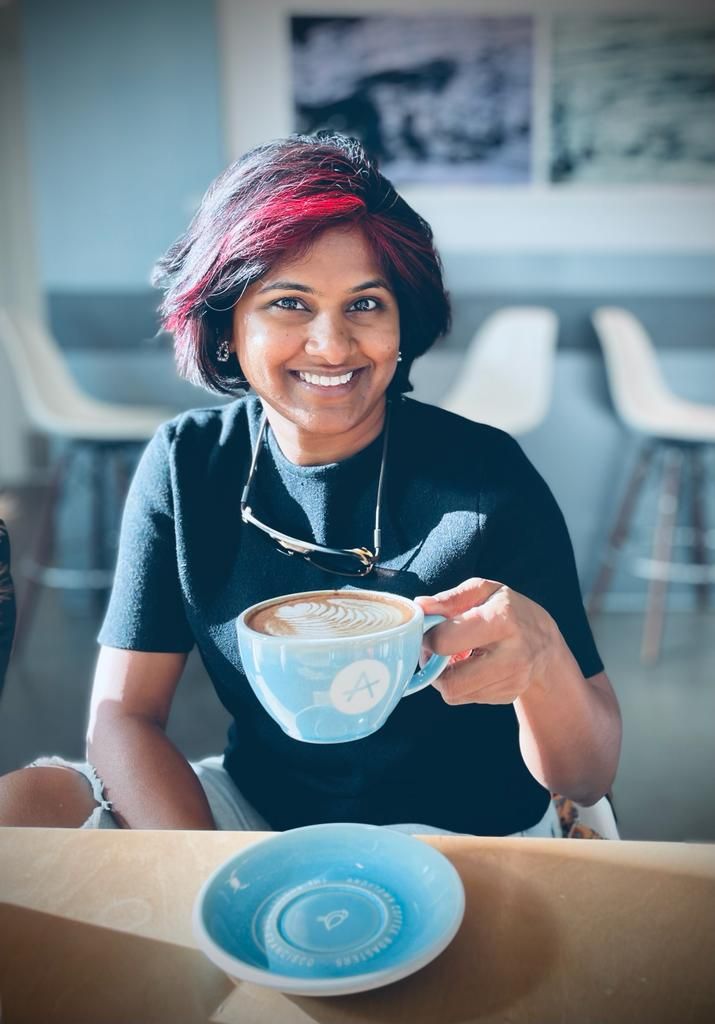 A confident & approachable portrait of a family, newborn and maternity Photographer. She loves coffee