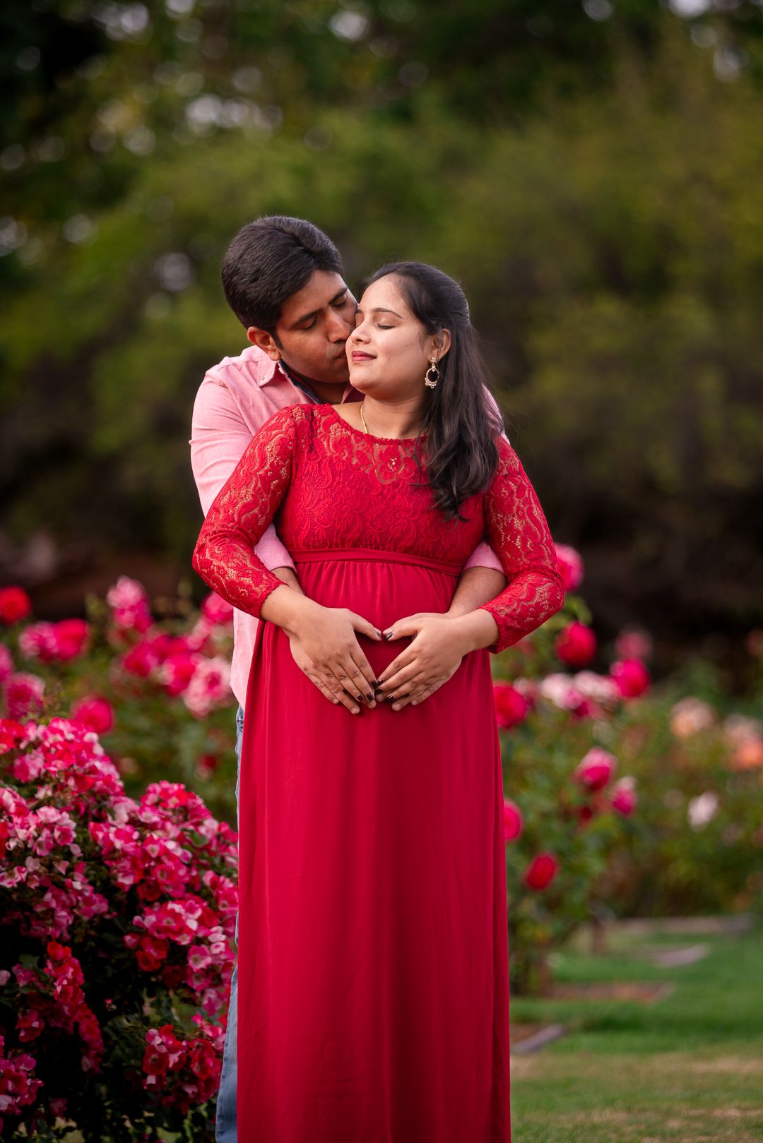 Pose idea of a Candid photo of couple near rose-lined path in San Jose municipal rose garden by pixels by pari