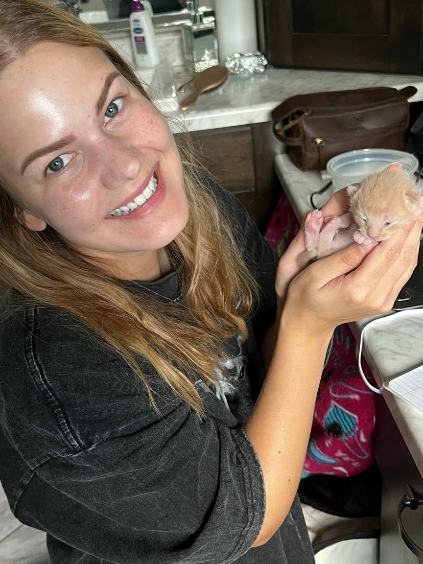 Branding image of a photographer in Brookings SD sharing her life, style and creative personality with a foster kitten.