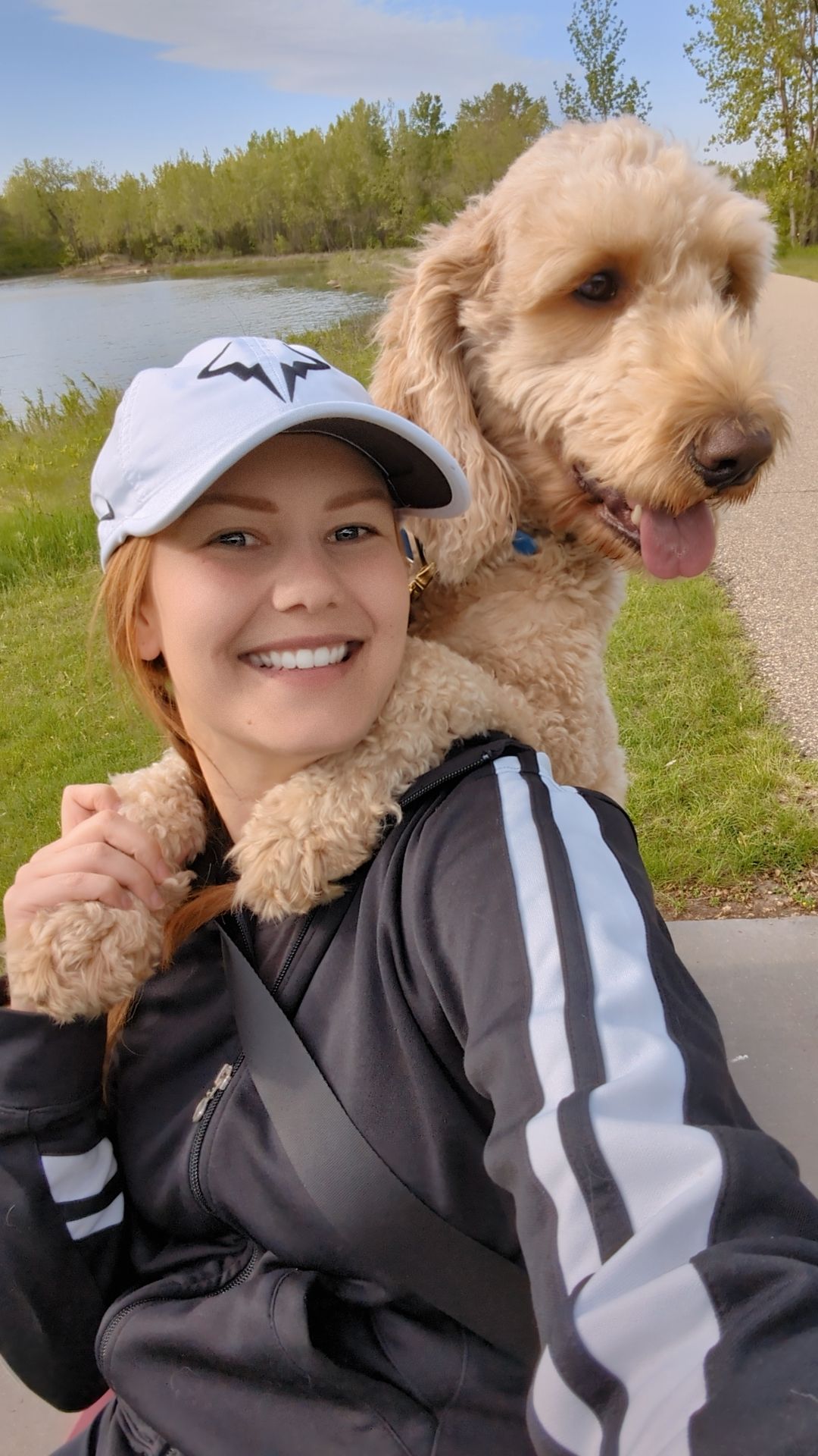 Branding image of a photographer in Brookings SD sharing her life, style and creative personality with her dog.