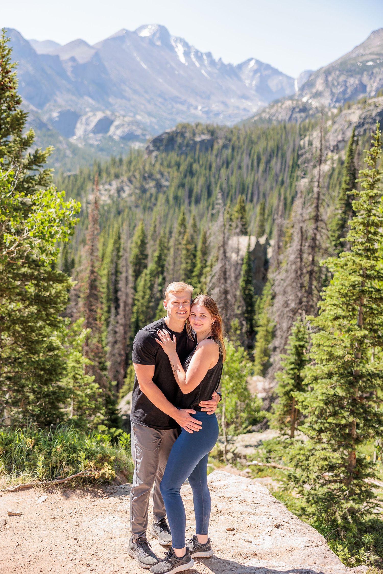 hiking couple eloping at Dream Lake, alpine scenery and glacial lake views, adventurous Rocky Mountain elopement