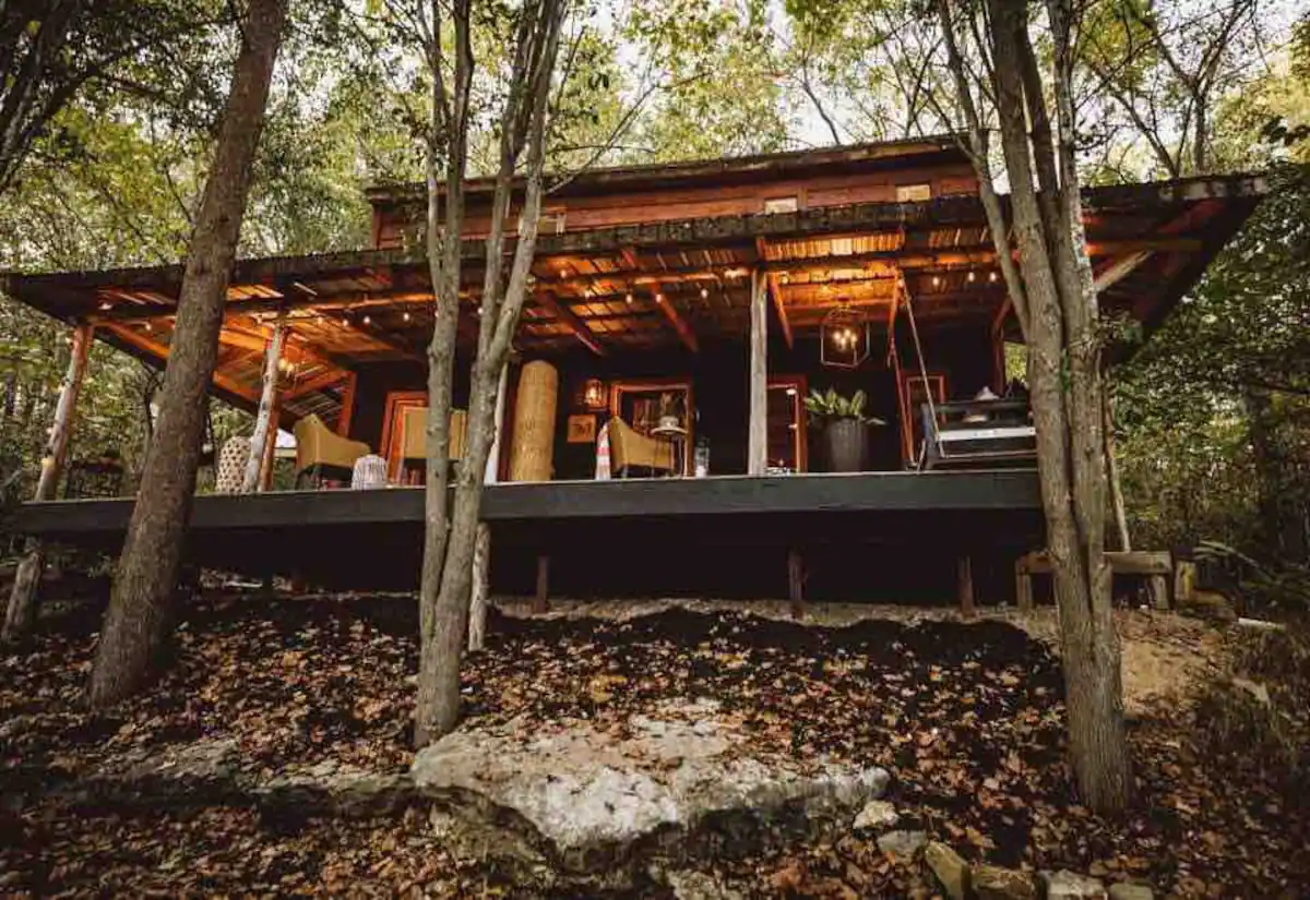 Crafting an Experience - Welcome to Ivory Gabel Cabin. Tucked between the Springfield & Branson area, this unique designed woodland cabin is a getaway awaiting. Explore nearby hiking & walking distance to Hootentown Canoe Rental. A cabin highlight is the large panoramic porch view, perfect for relaxing & sipping your morning coffee. At night, enjoy the outdoor movie theatre experience around the fire listening to the Ozarks wildlife.