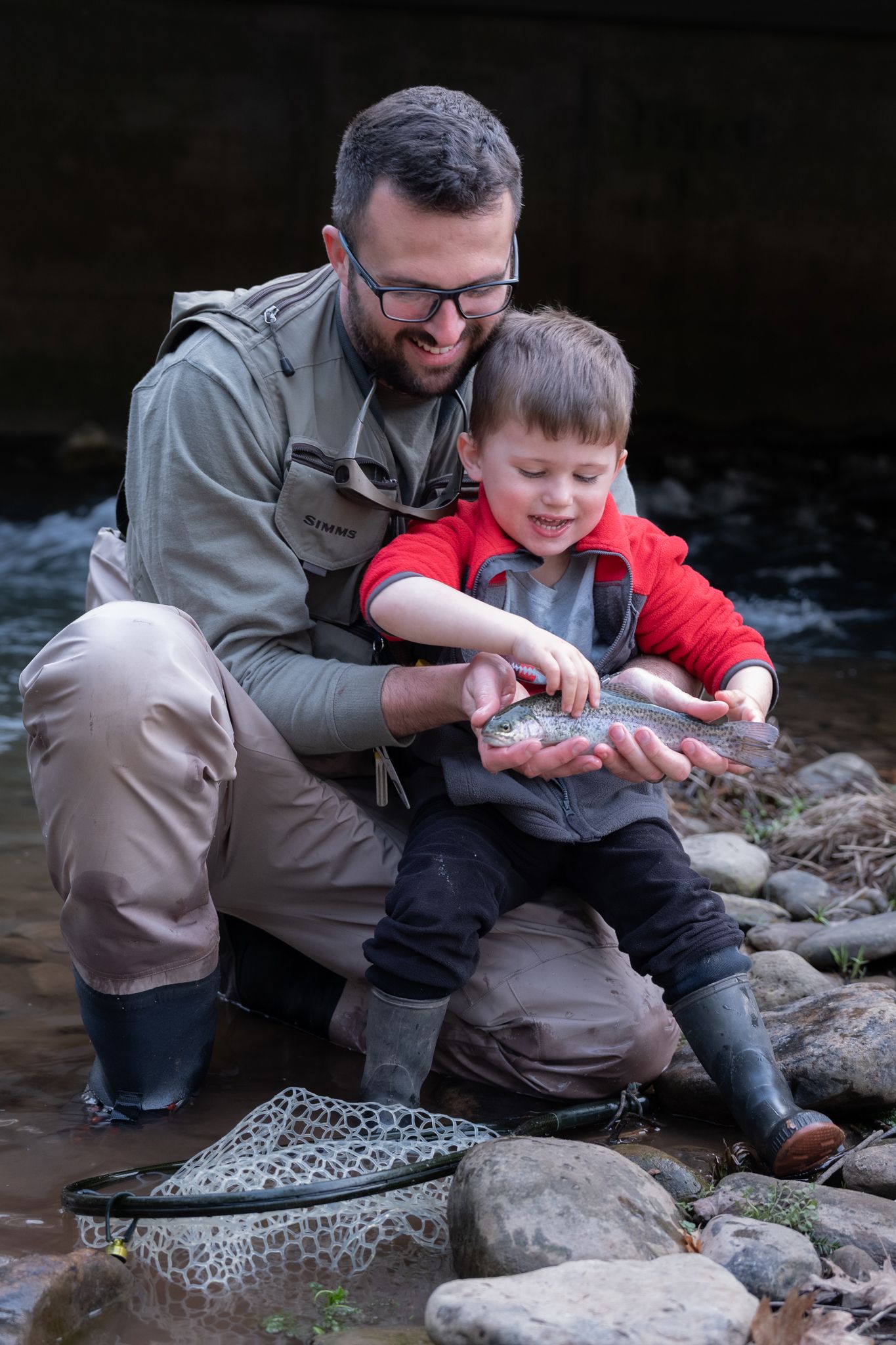 Father and son fishing candid photo