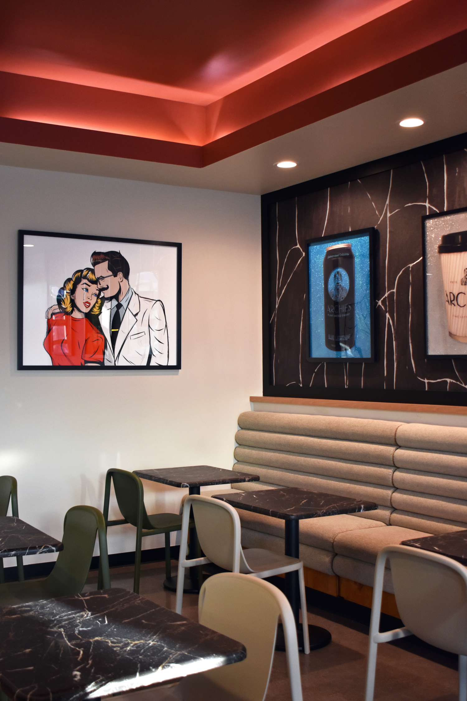 Archies Fine Coffee lounge interior in San Antonio with curated pop art and modern booth seating