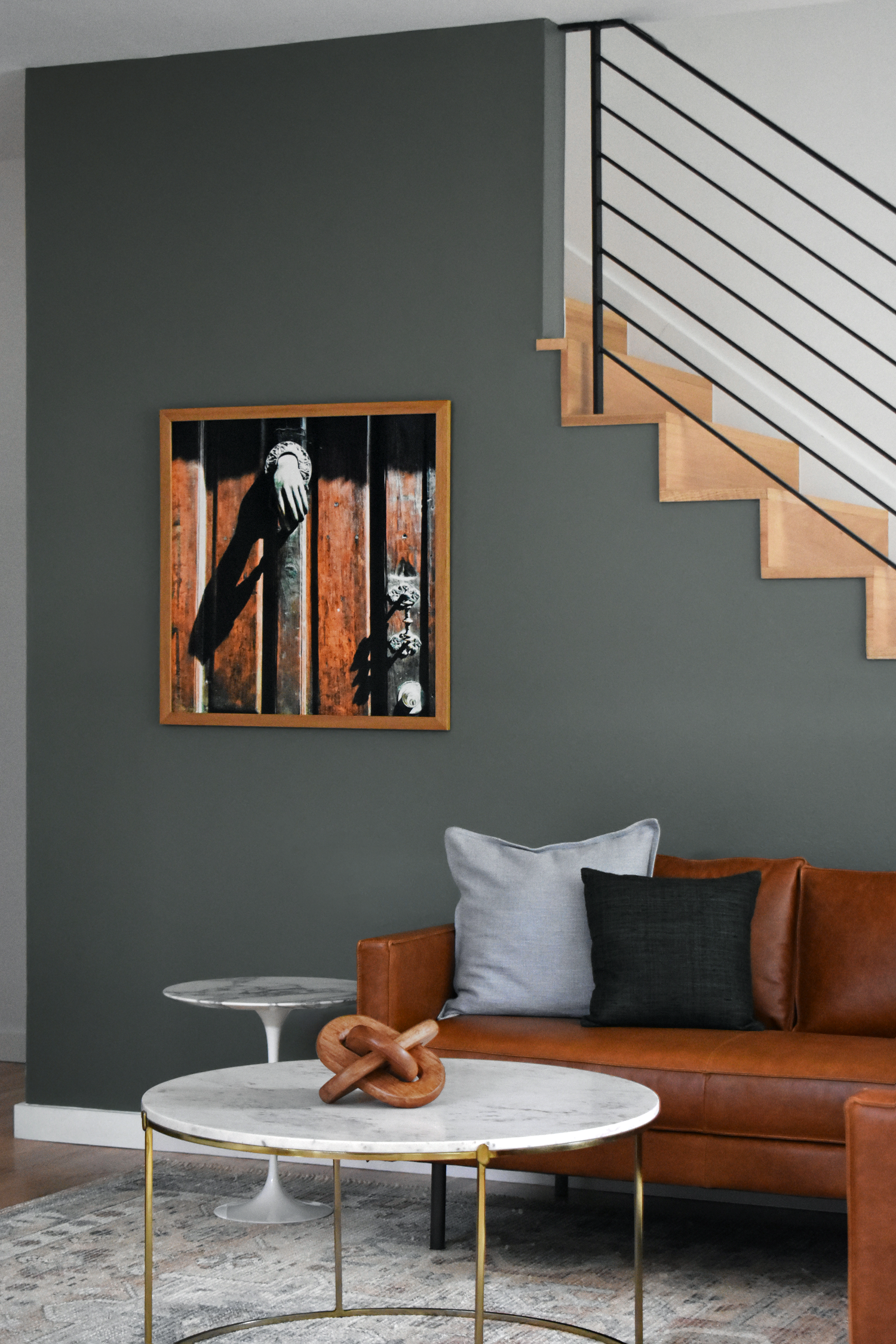 Residential living room in San Antonio with leather sofa, marble coffee table, and curated western artwork