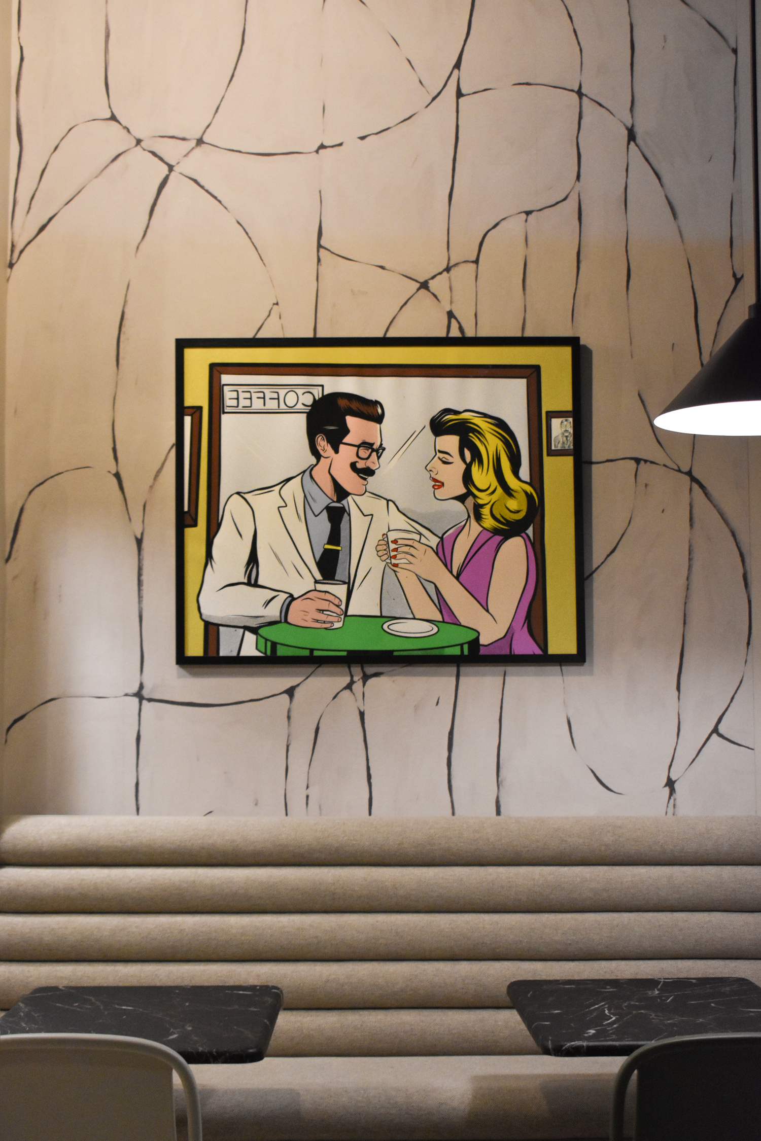 Archies Fine Coffee lounge in San Antonio with curated pop art framed print and booth seating