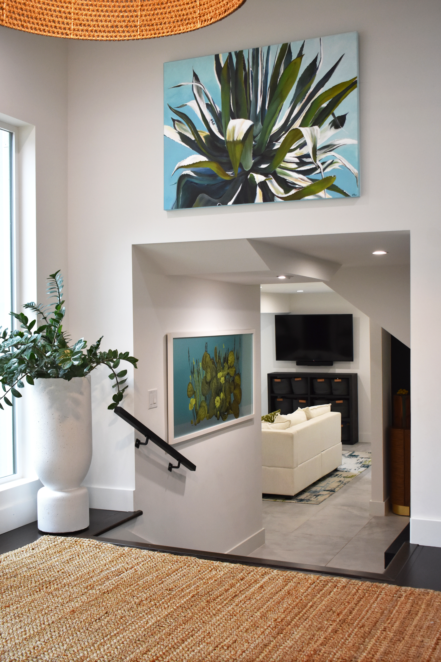 Residential home interior in San Antonio with open layout and curated botanical artwork