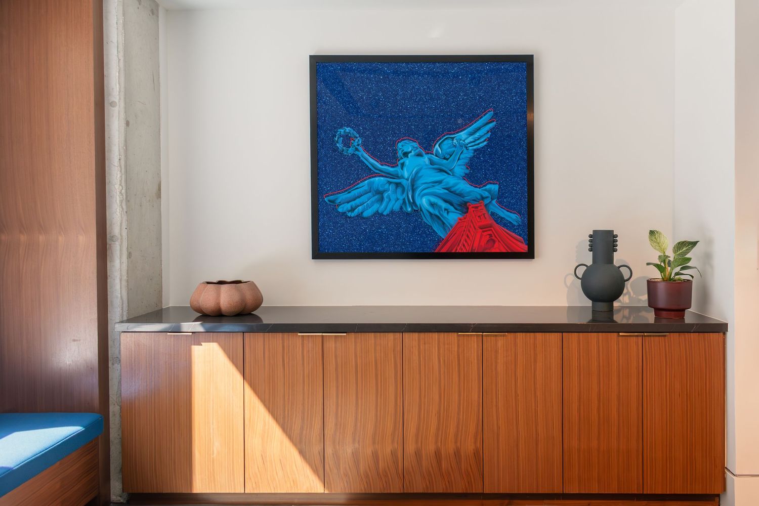 Curated art installation at The Continental Residences in downtown San Antonio featuring bold blue painting