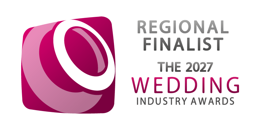 Regional Finalist badge for The 2027 Wedding Industry Awards featuring a pink and white spiral logo design.