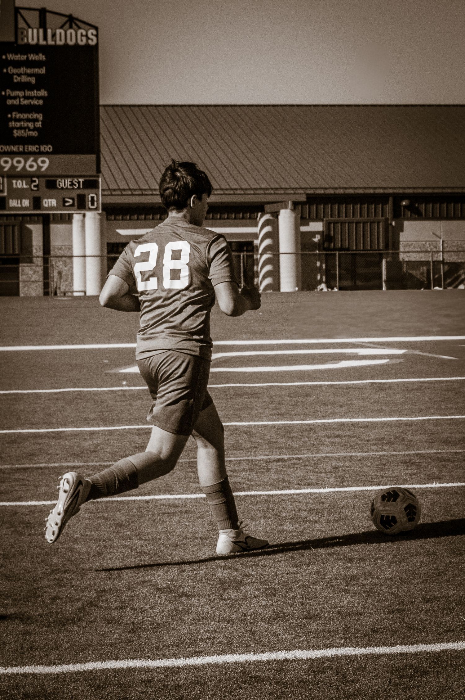 Athlete running across soccer feild