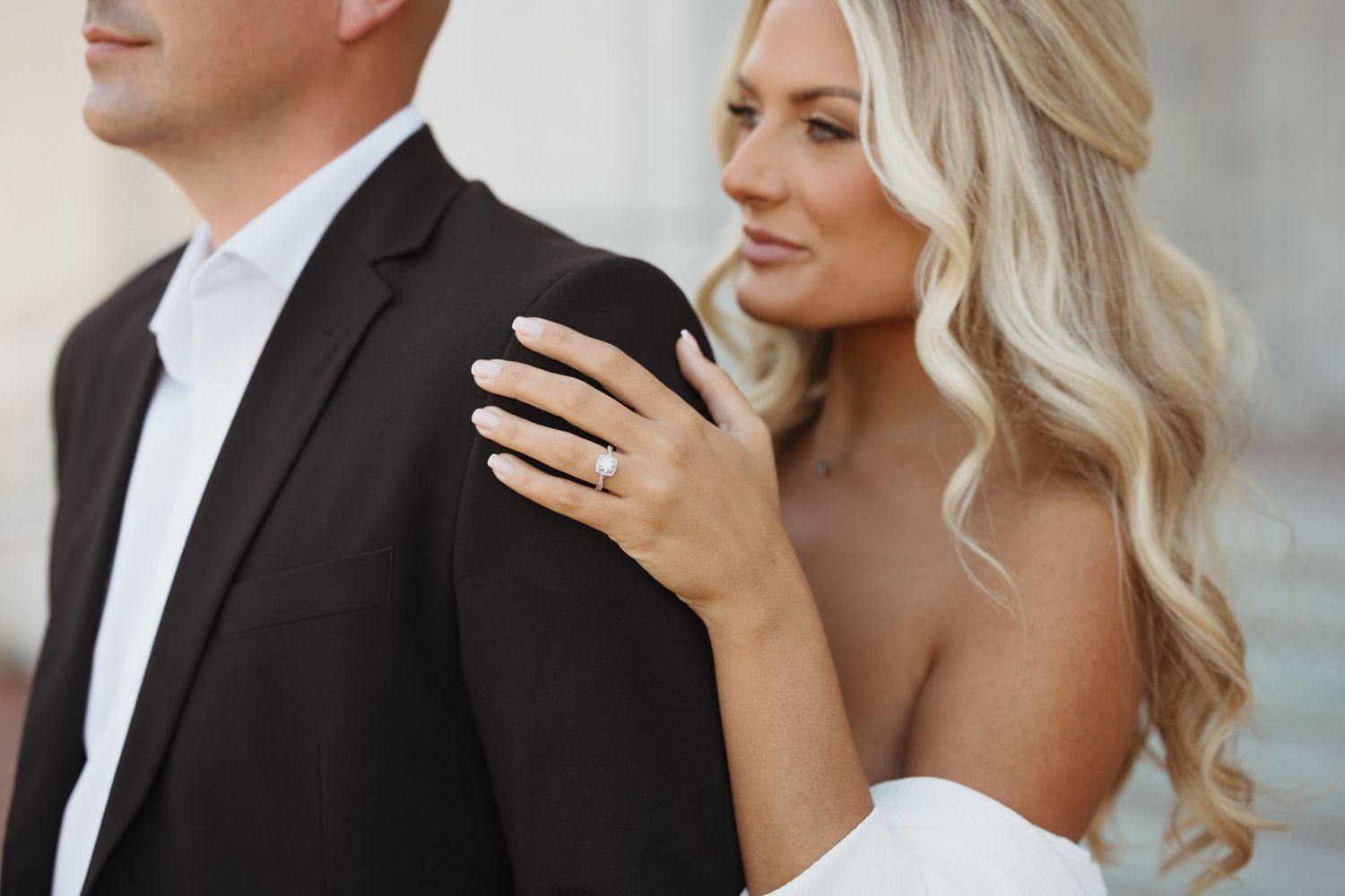 Elegant wedding couple shares intimate moments in a series of romantic poses against a light backdrop.