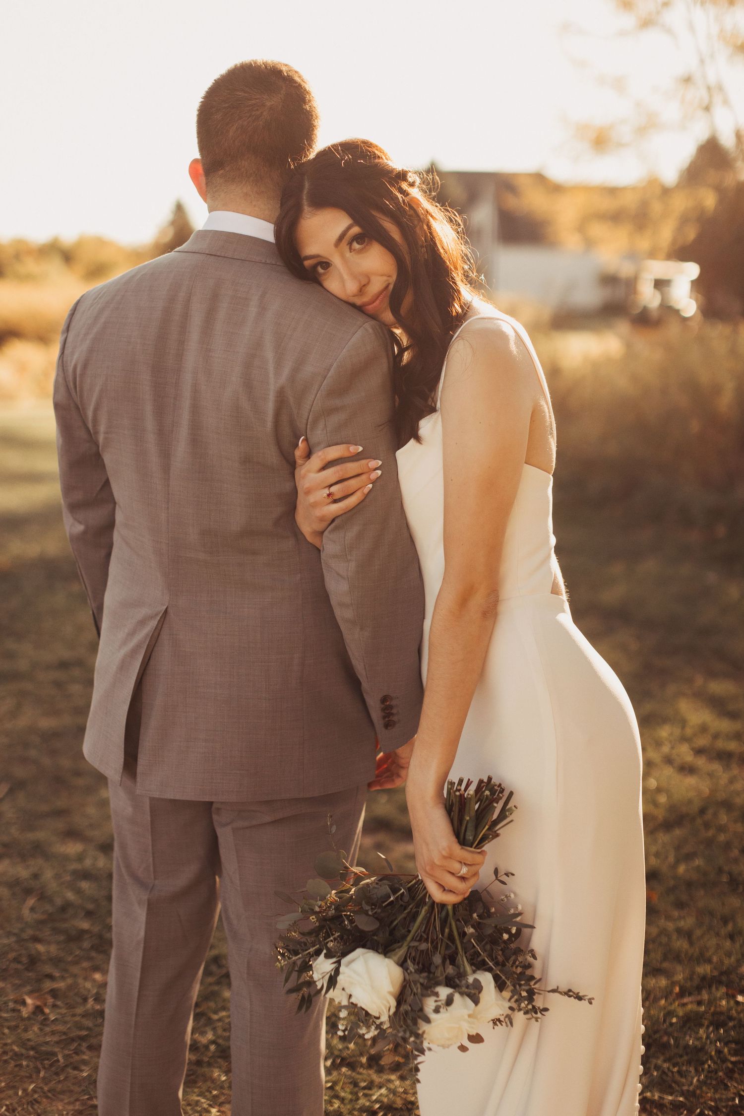 Sunset wedding portraits showing intimate moments between newlyweds.