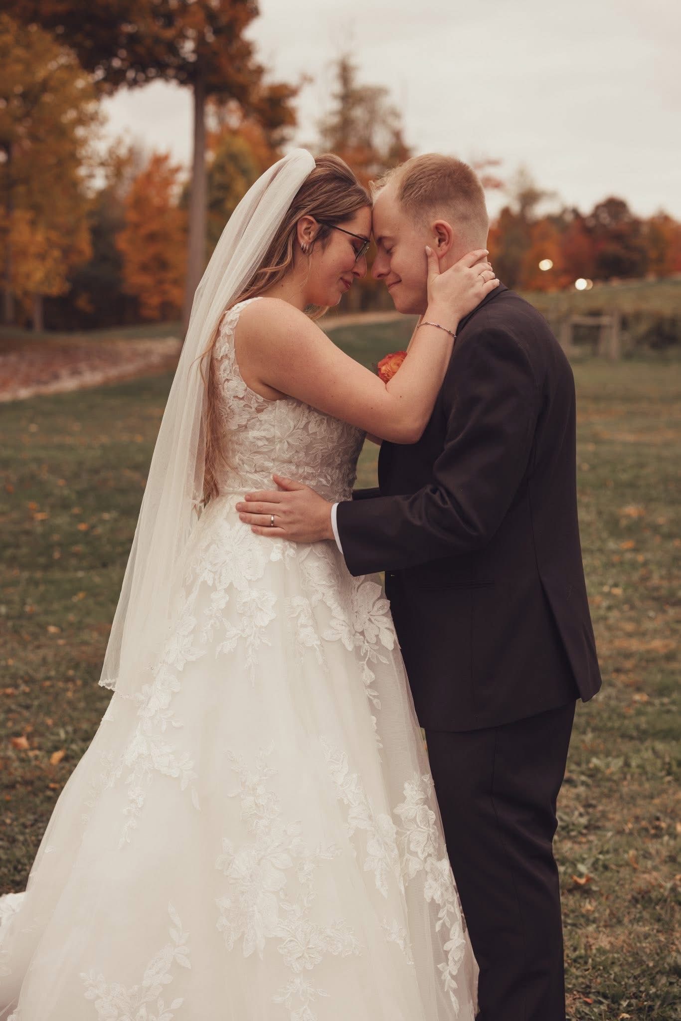 Intimate autumn wedding portraits with couple in formal attire.