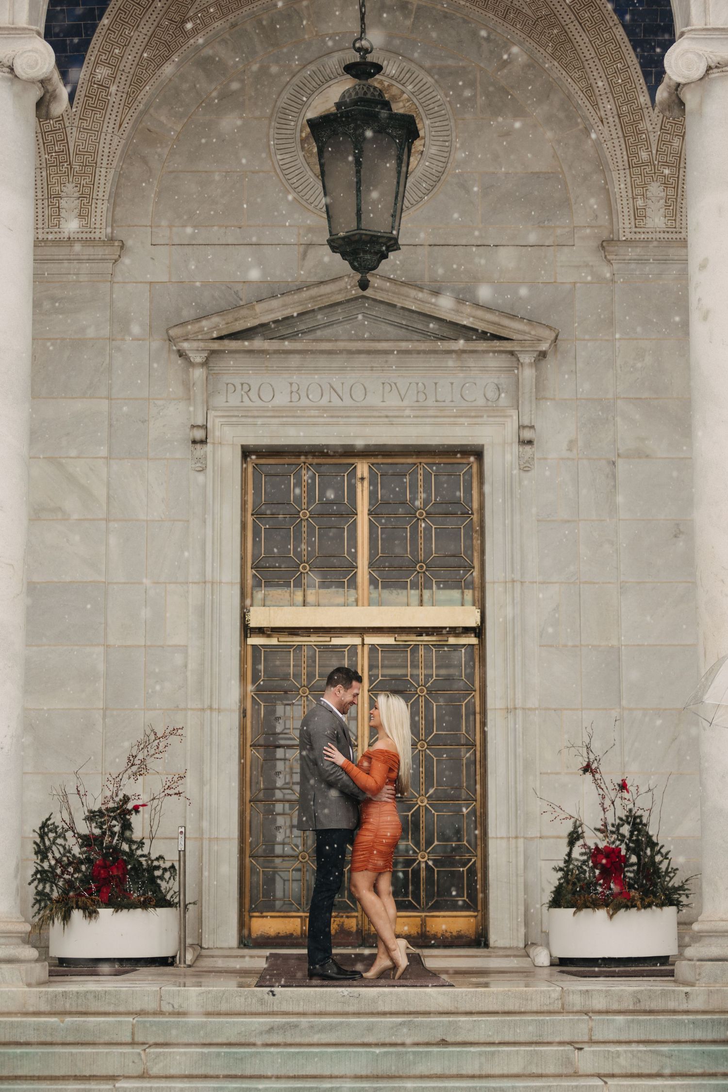 A creative wedding photo sequence showing playful interaction through ornate stone building windows.