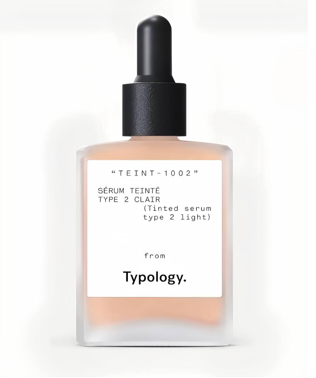 Typology tinted serum in a glass dropper bottle with minimalist packaging design.
