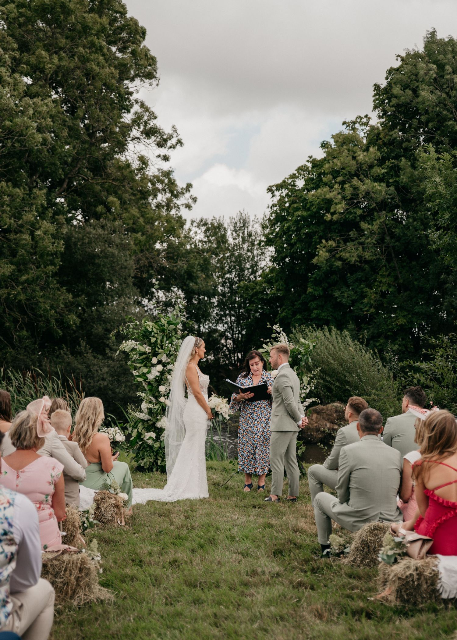 couple standing down the aisle