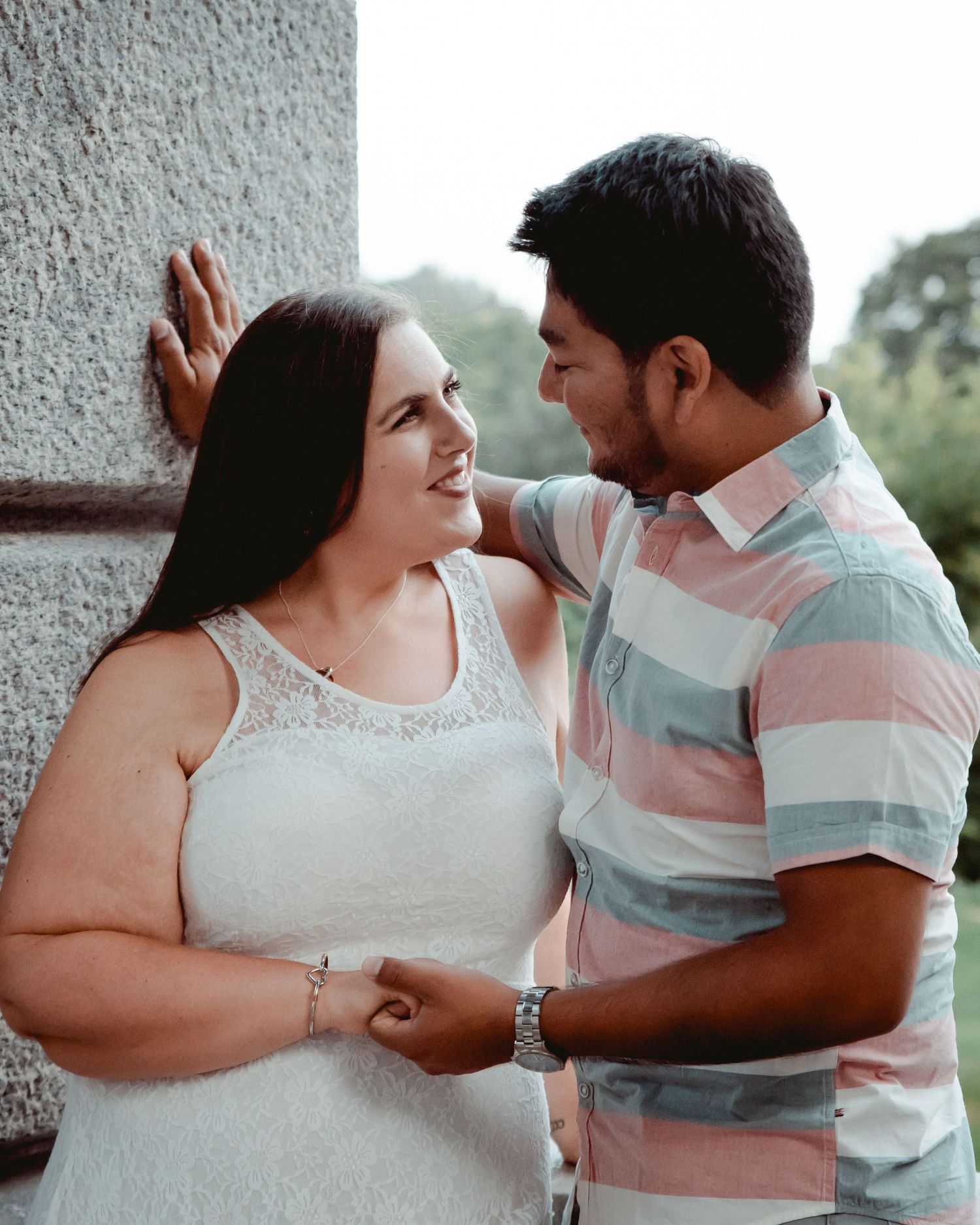 A sweet moment between a newly engaged couple in Westchester, NY. The beautiful Kensico Dam and trees set the background.