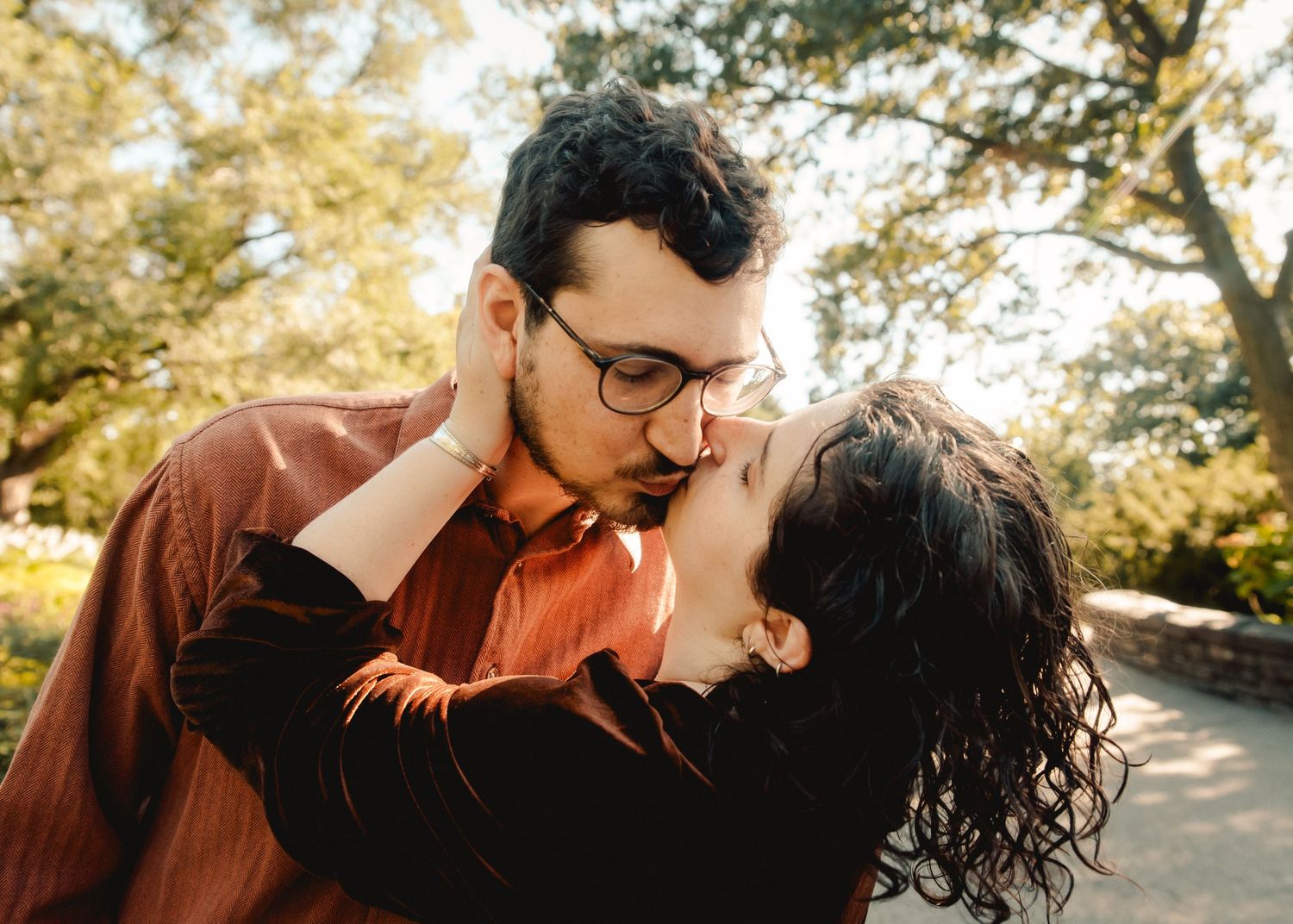 A couple kissing during their engagement photo session in New York City