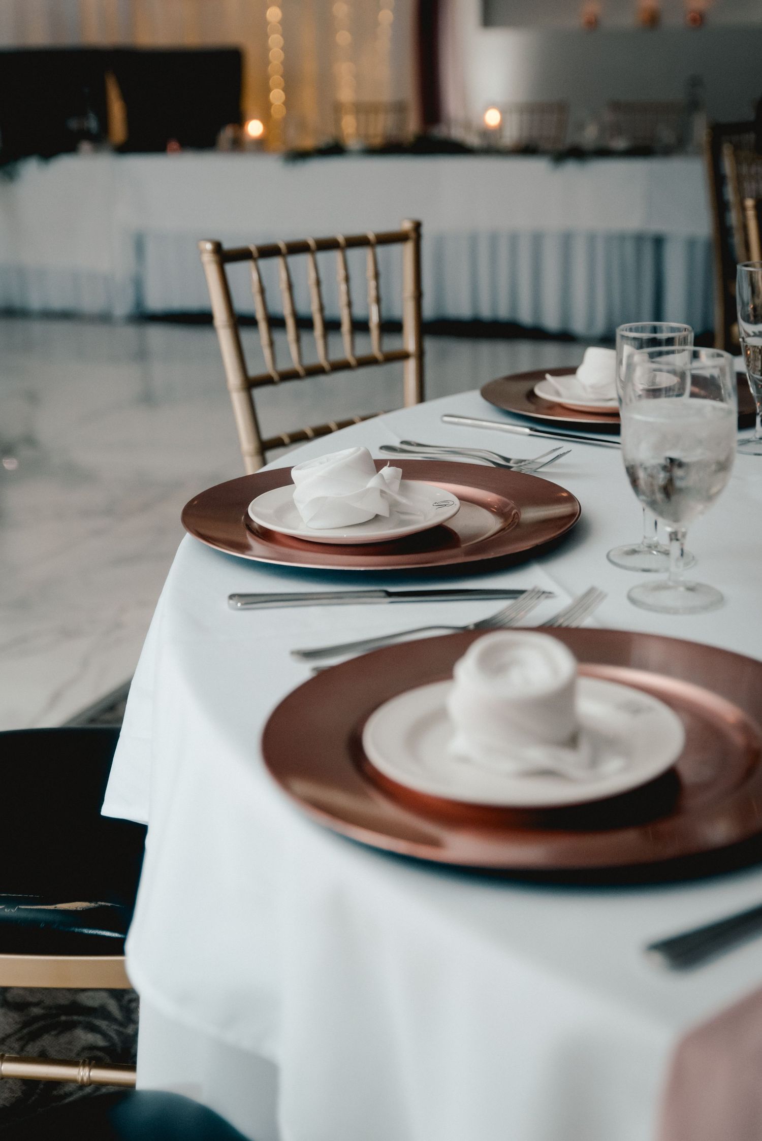 Details of the place settings for guests including rose gold plates for each guest at the Riverdale in Endicott, NY.