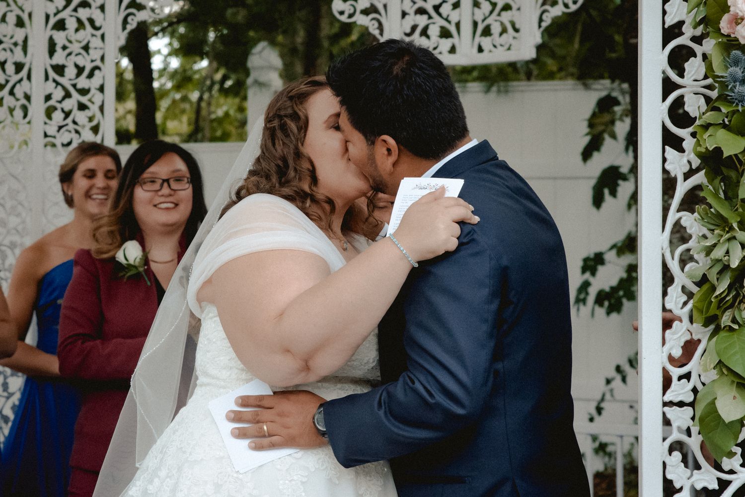 A bridge and groom share their first kiss as husband and wife after saying 