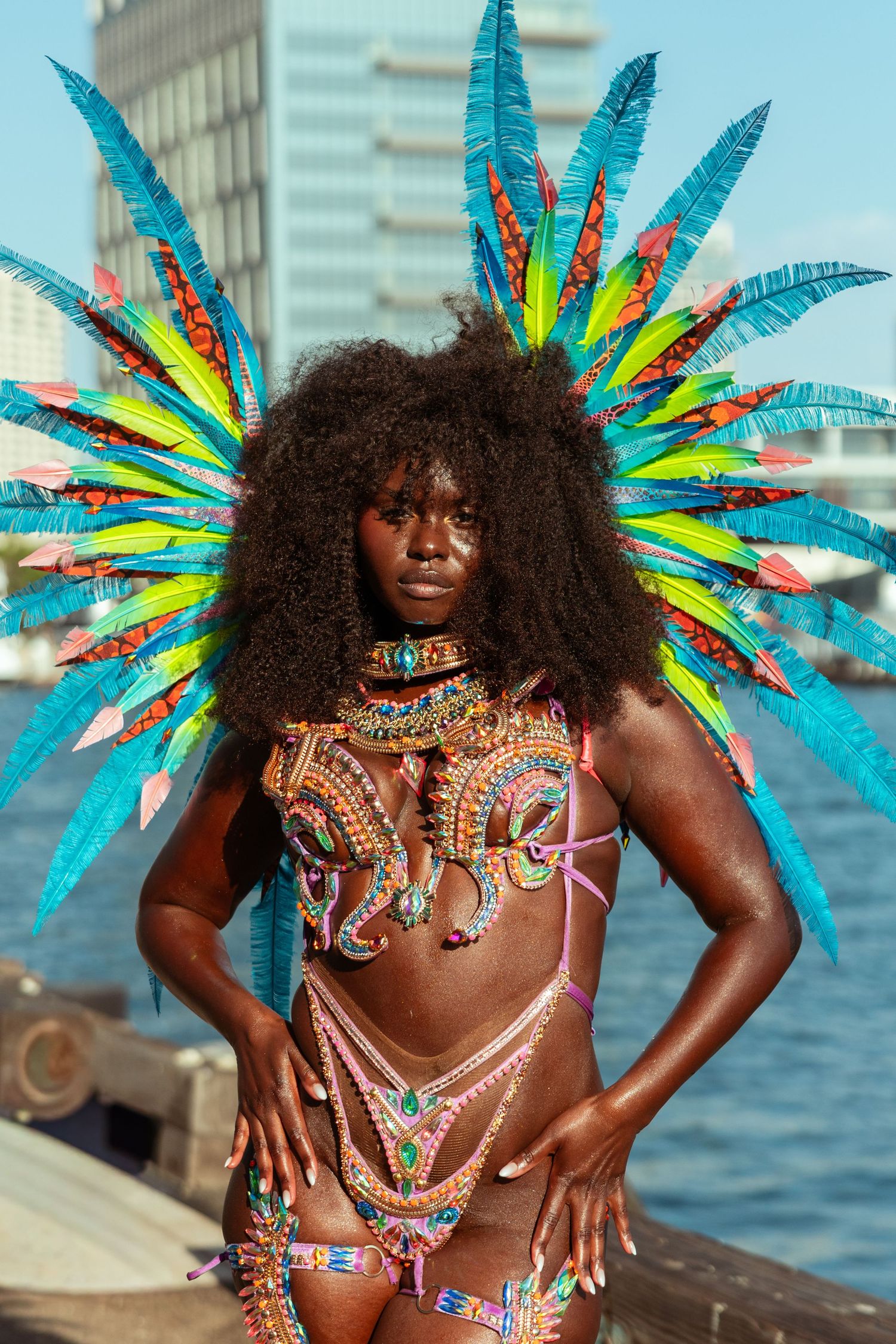 Runway model in a feathered costume at San Diego Swim Week