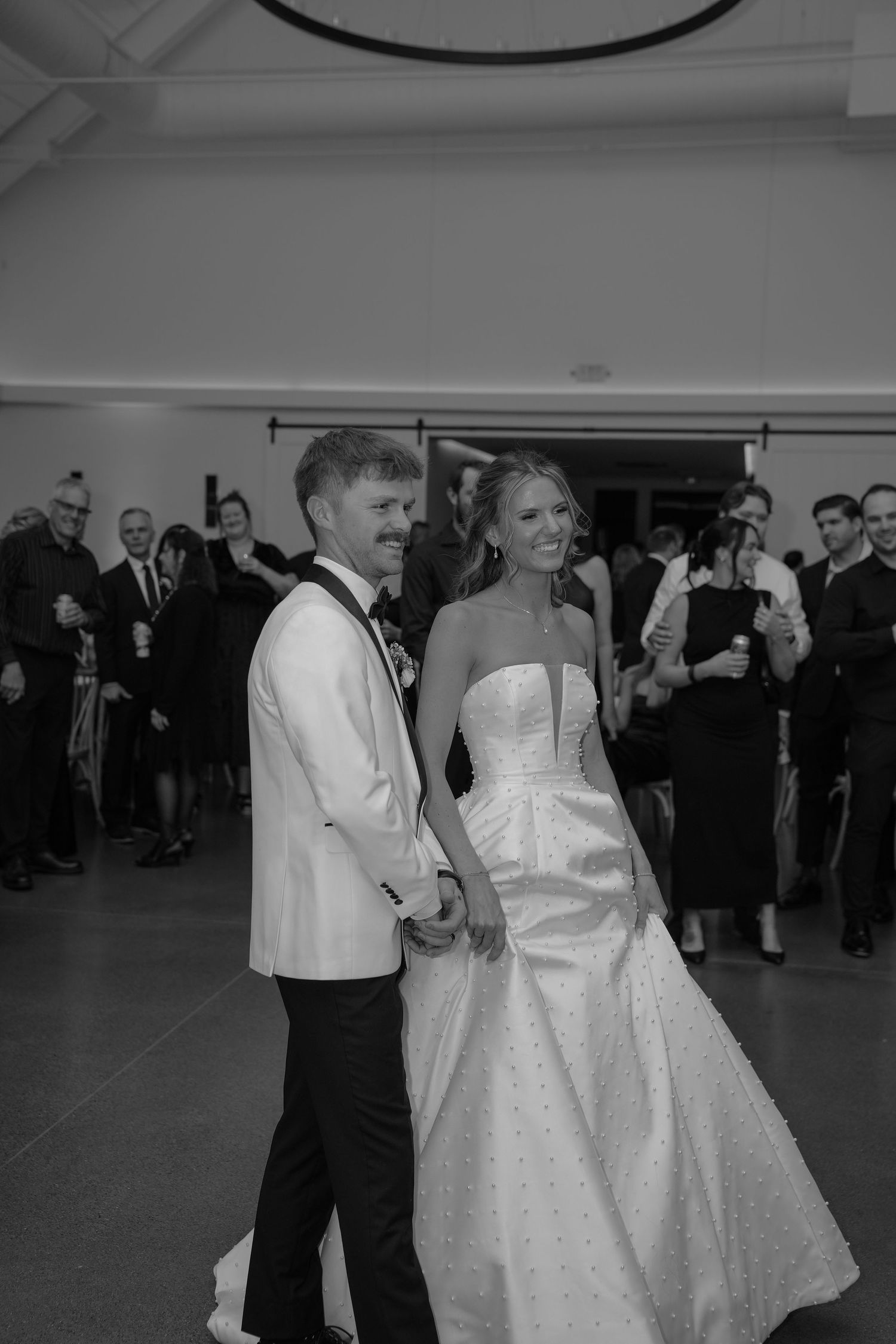 A couple shares their first dance at their wedding reception.