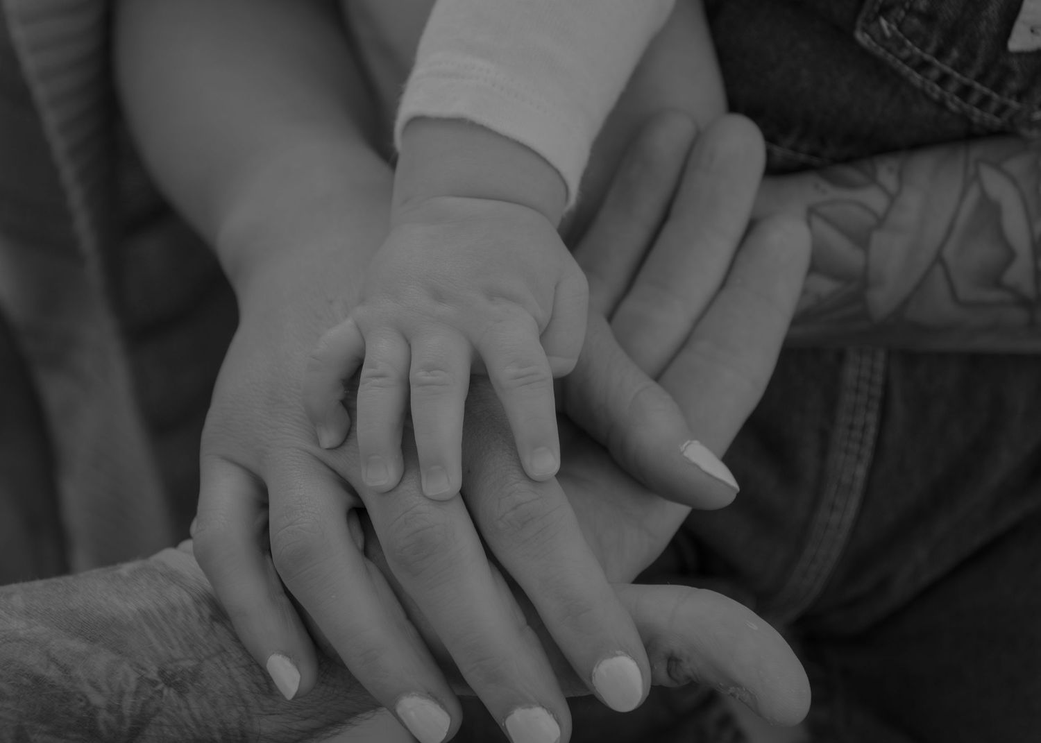 Close-up sequence of hands holding and intertwining with each other.