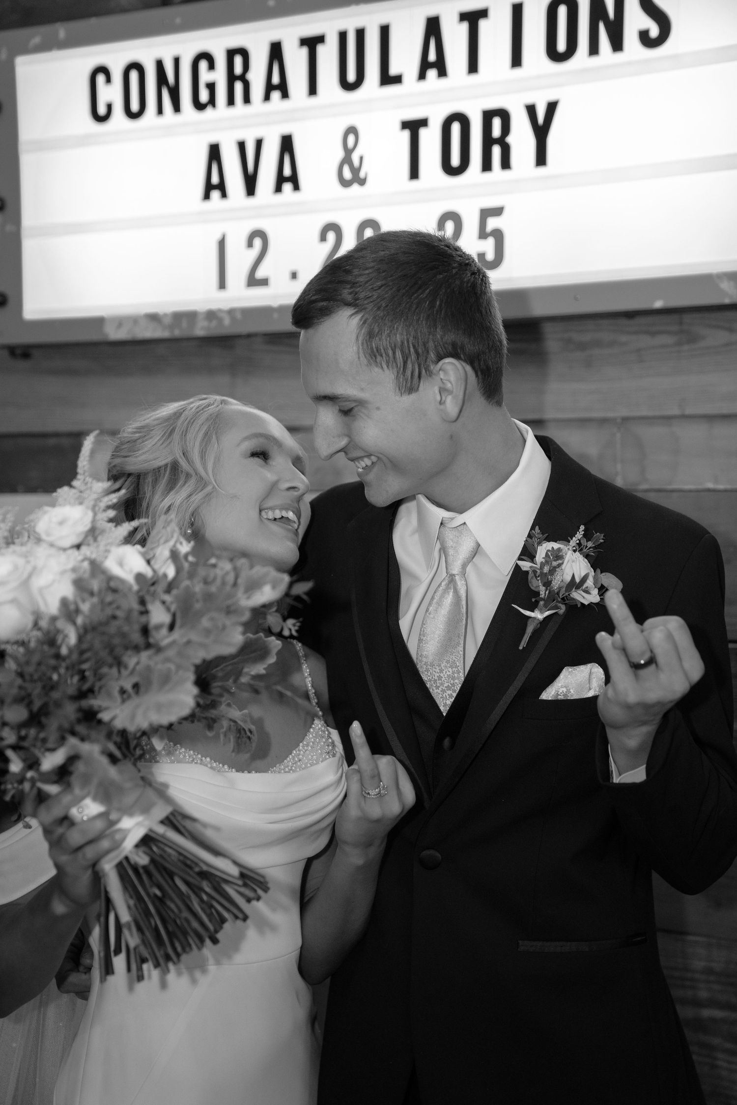 Black and white wedding photos showing romantic moments with a congratulations sign visible.