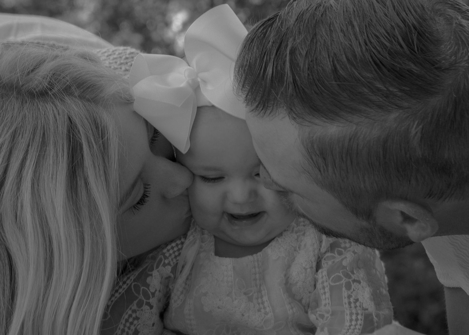 Black and white intimate portrait series showing tender moments between a couple.