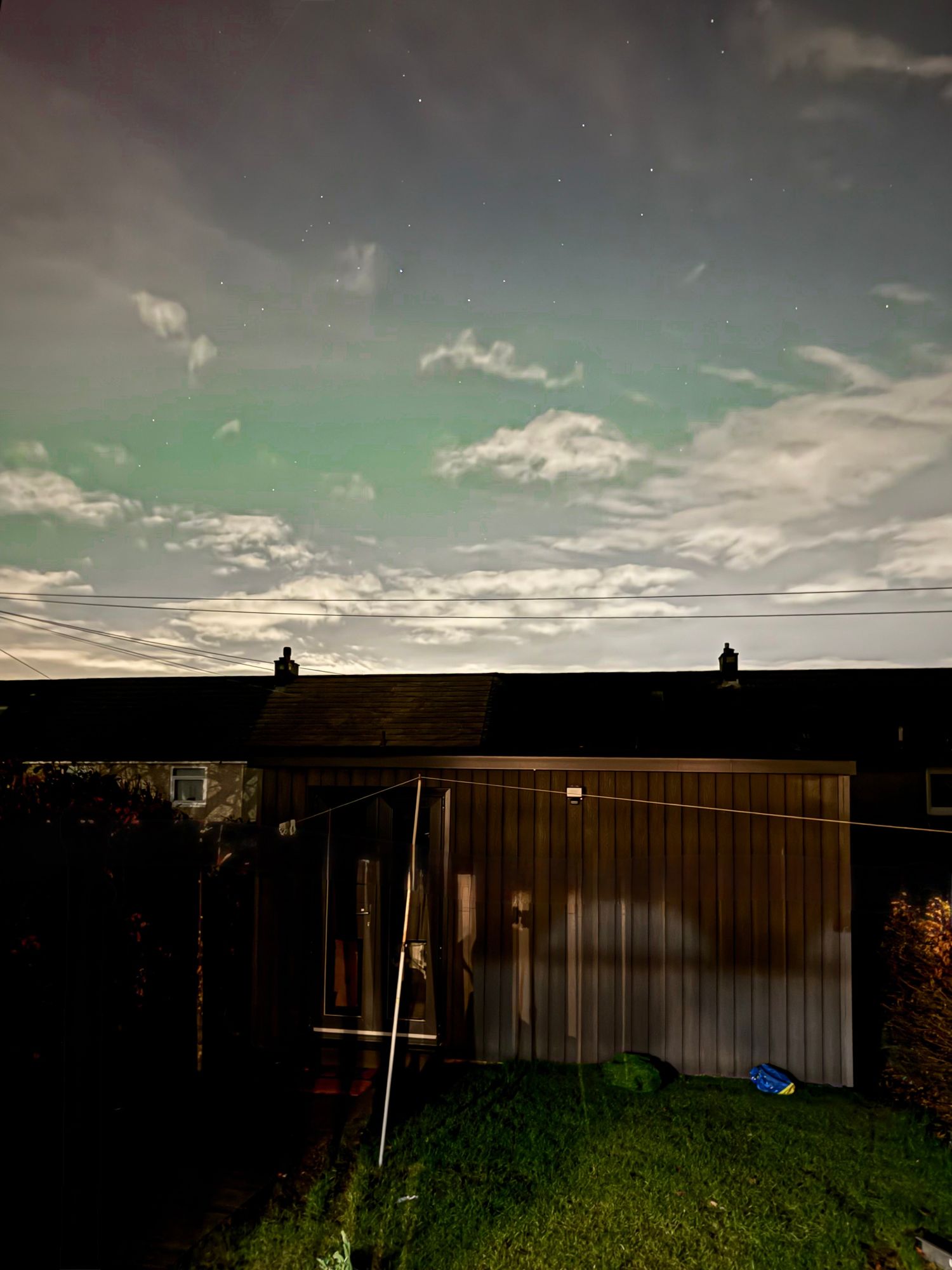 DandSPhotography studio in East Kilbride with the Northern Lights in the sky above