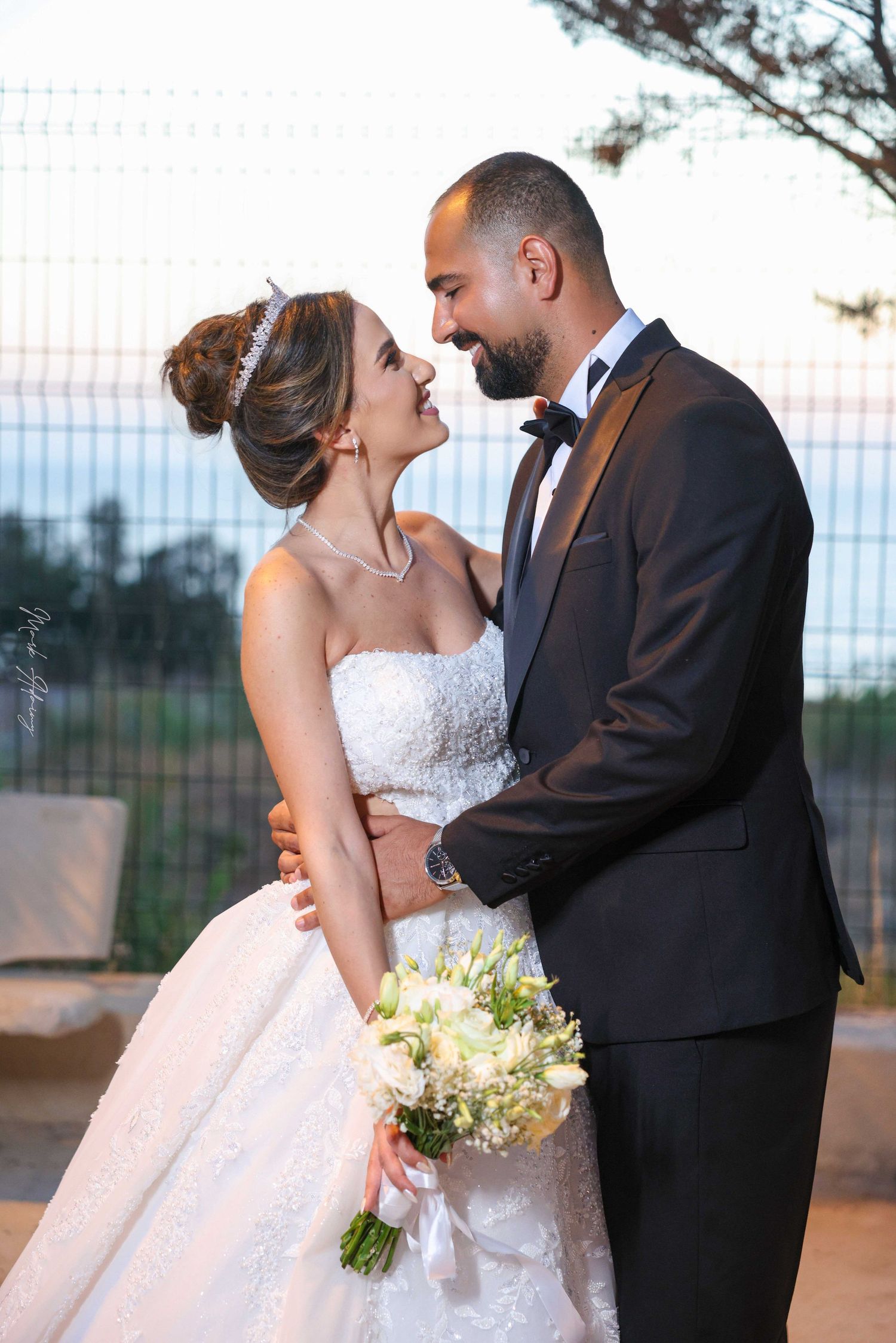 Tender Lebanese wedding couple embrace captured with cinematic artistry