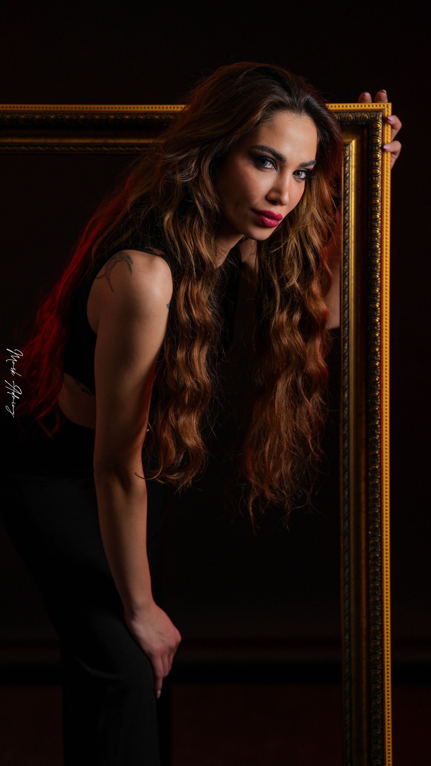 Lebanese female model posing inside a vintage frame at CMA Productions Beirut