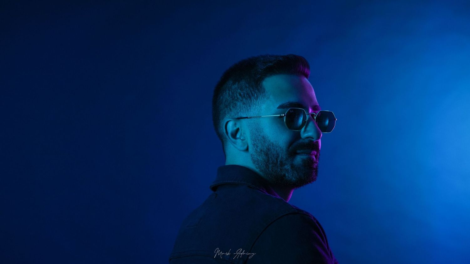 Attractive Lebanese young man with distinguished multicolor lighting at CMA Productions Beirut