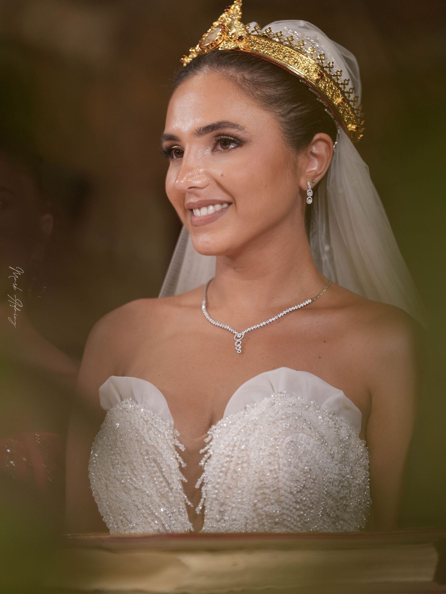 Picture of a Lebanese bride in the ceremony with the golden crown