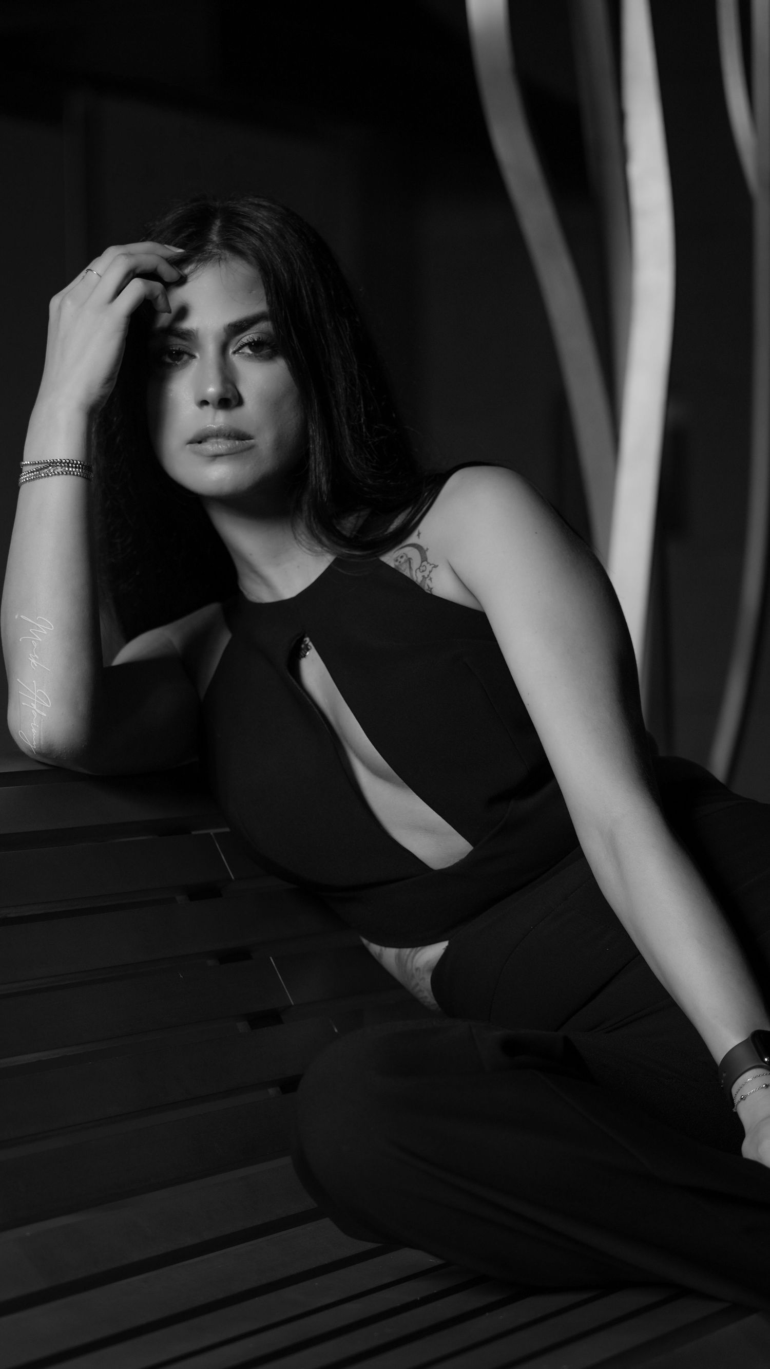 Lebanese young female model in black and white on bench in Downtown Beirut