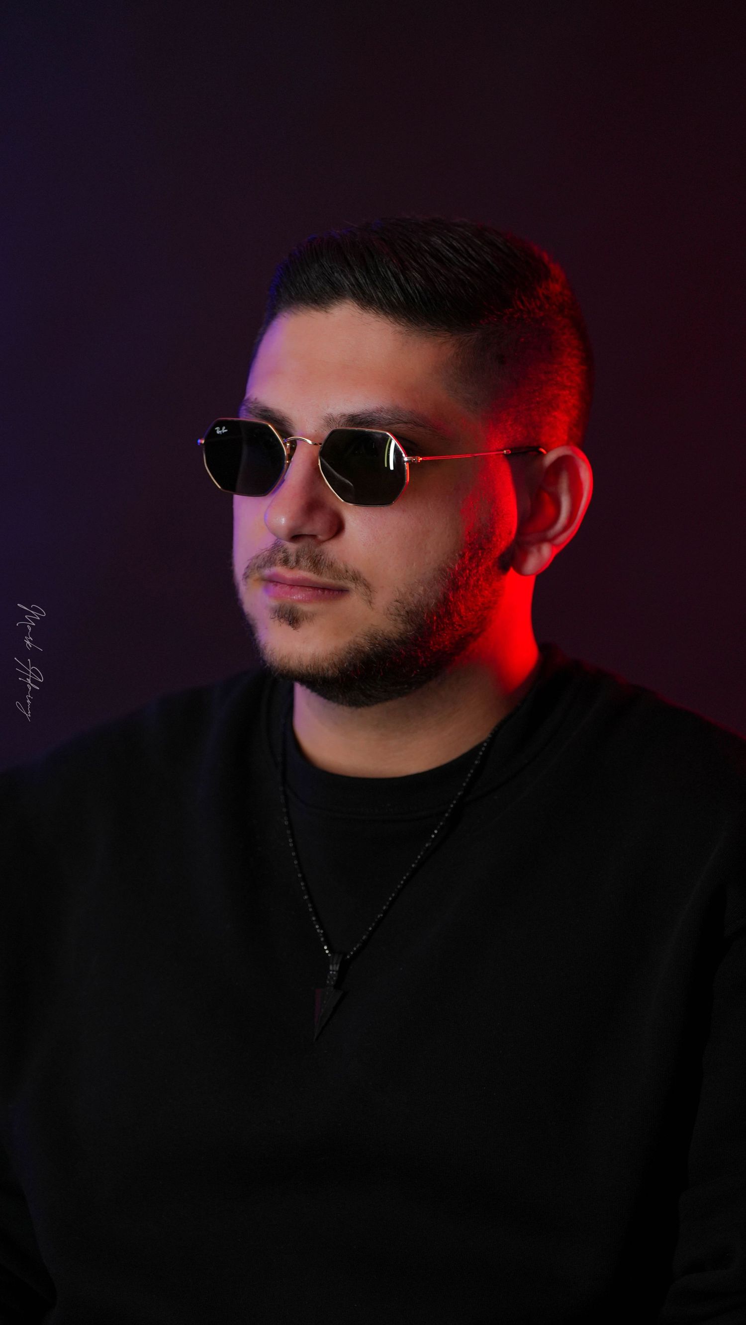 Lebanese young man portrait with red lighting at CMA Productions Beirut