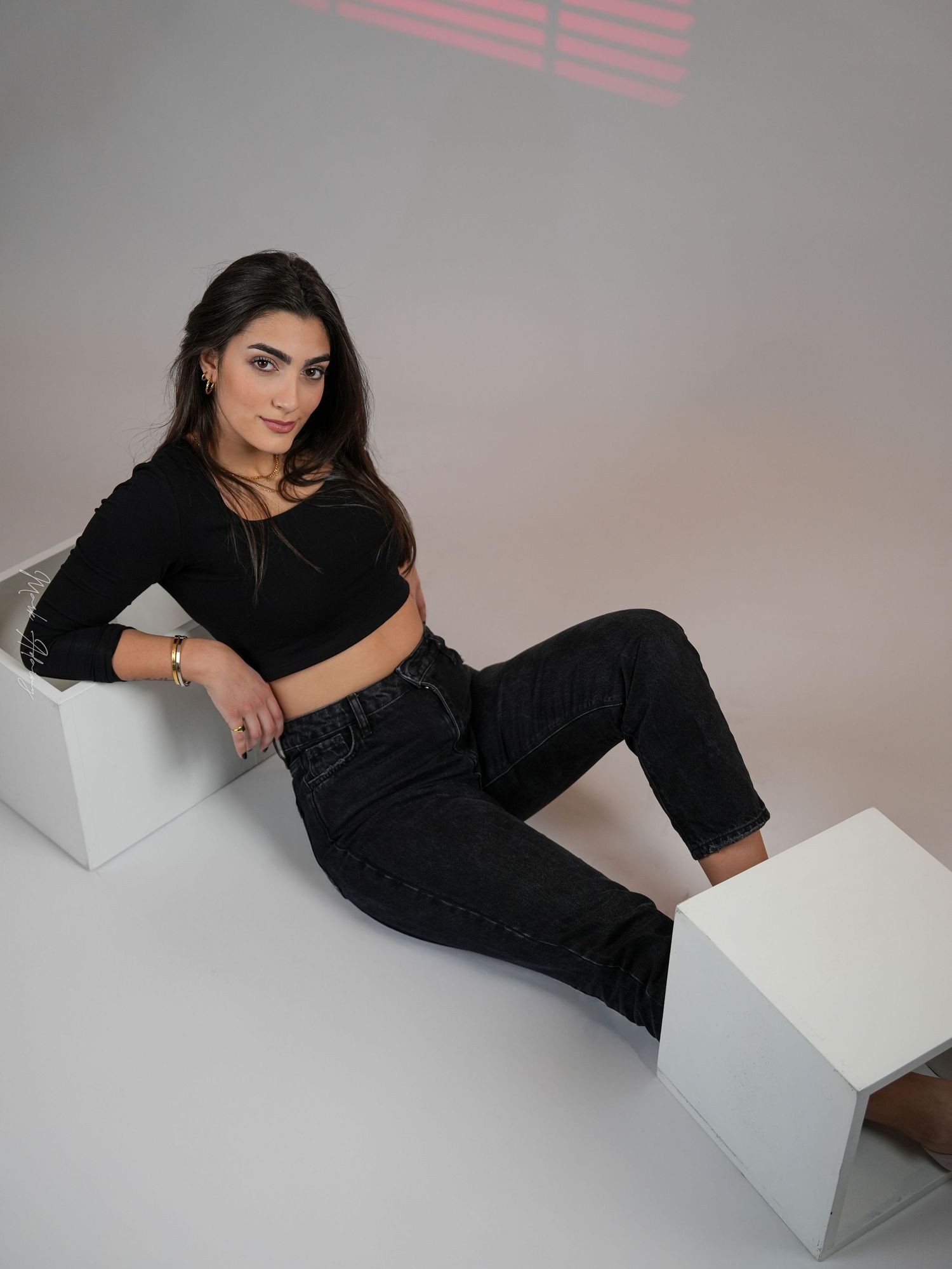 Lebanese athletic model in an artistic pose with simple background  at CMA Productions Beirut