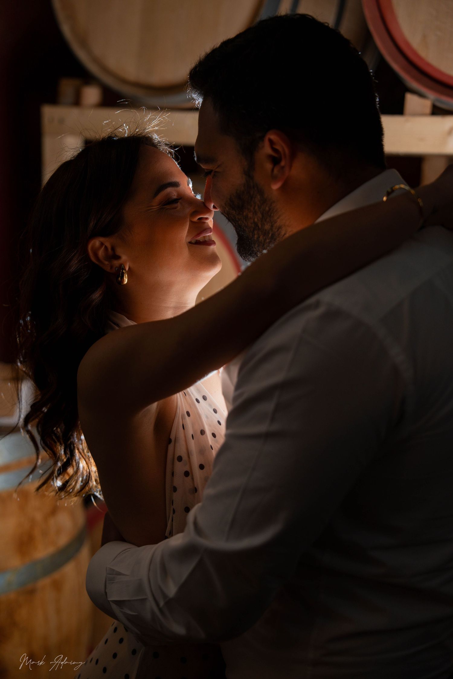 Romantic Lebanese couple enjoying joyful pre‑wedding moment at Riachi Winery and Distillery