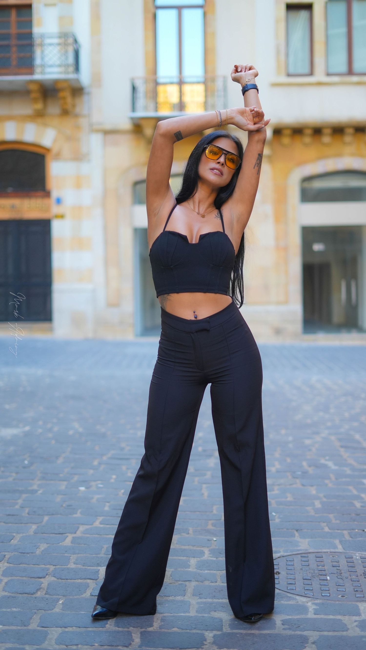 Wide shot for a Lebanese young female model in Black outfit in Beirut Souks Downtown