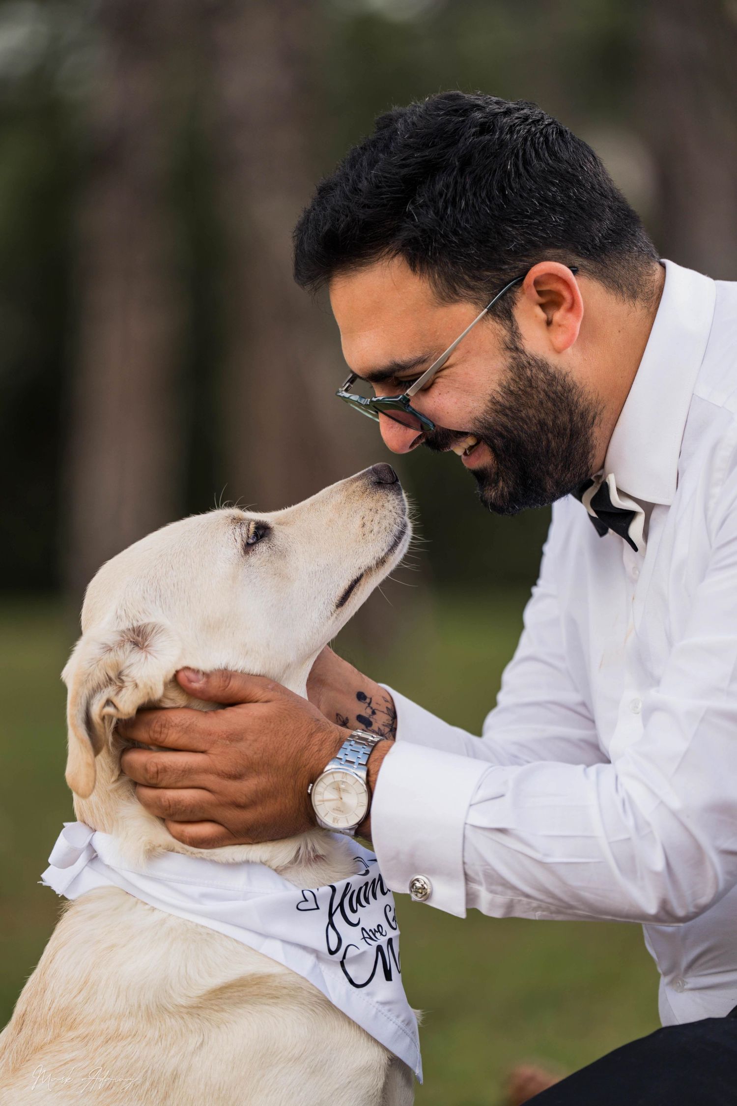 Lebanese Groom to be patting his dog at Riachi Winery and Distillery