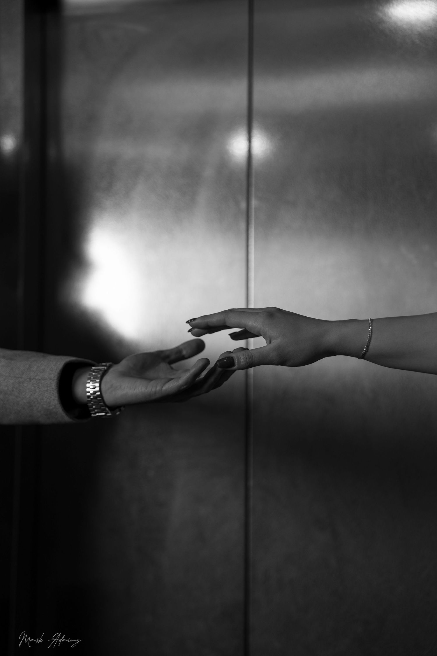 Lebanese couples holding hands in black and white at Queens Plaza Beirut