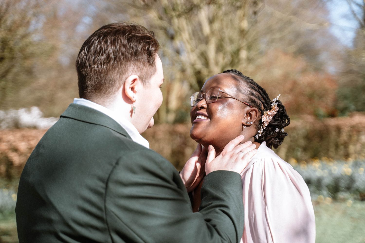 Couple smiling together outdoors during Manchester LGBTQ wedding