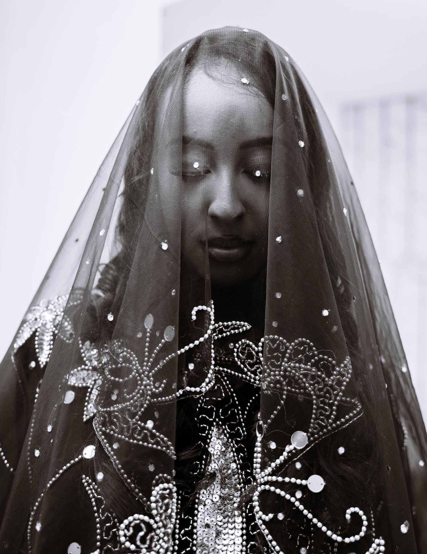 Black-and-white portrait of a bride wearing a veil during a London Somali nikah wedding