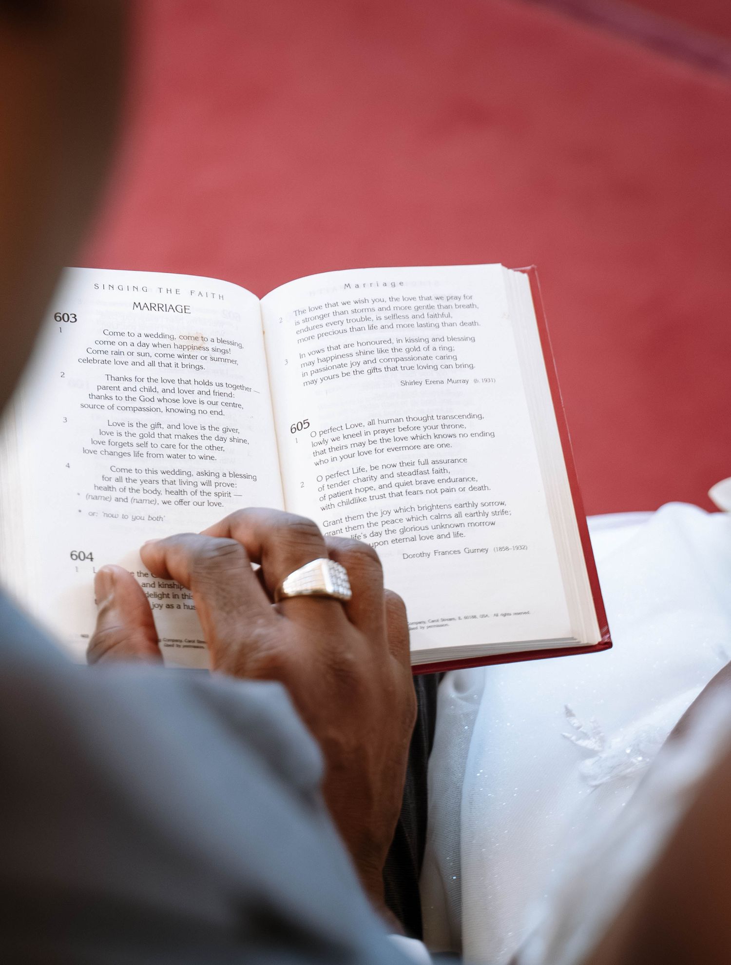 Bride and groom reading the bible at a Jamaican church wedding in Birmingham