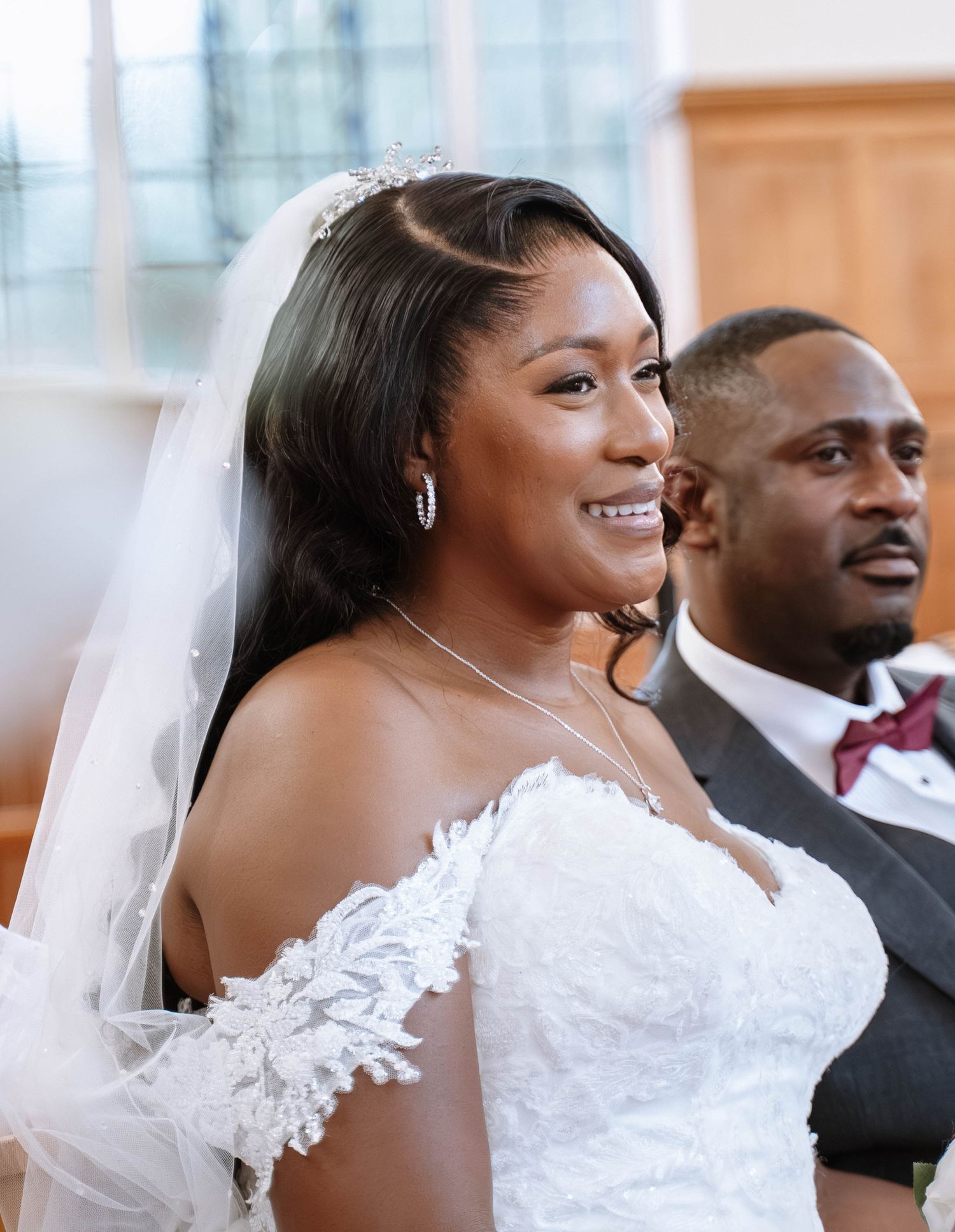 Bride smiling during Jamaican church wedding ceremony in Birmingham
