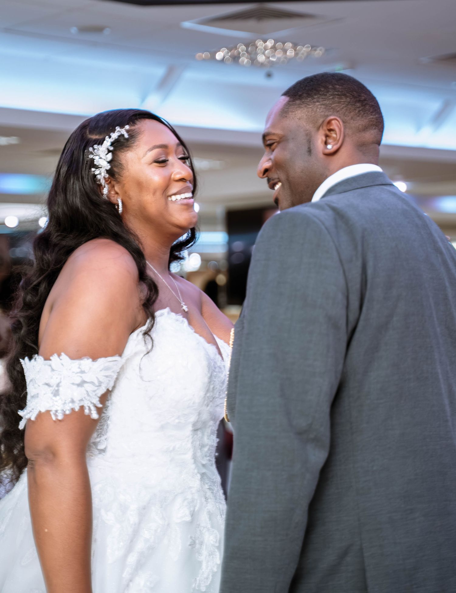 Bride and groom smiling together during Jamaican wedding reception in Birmingham