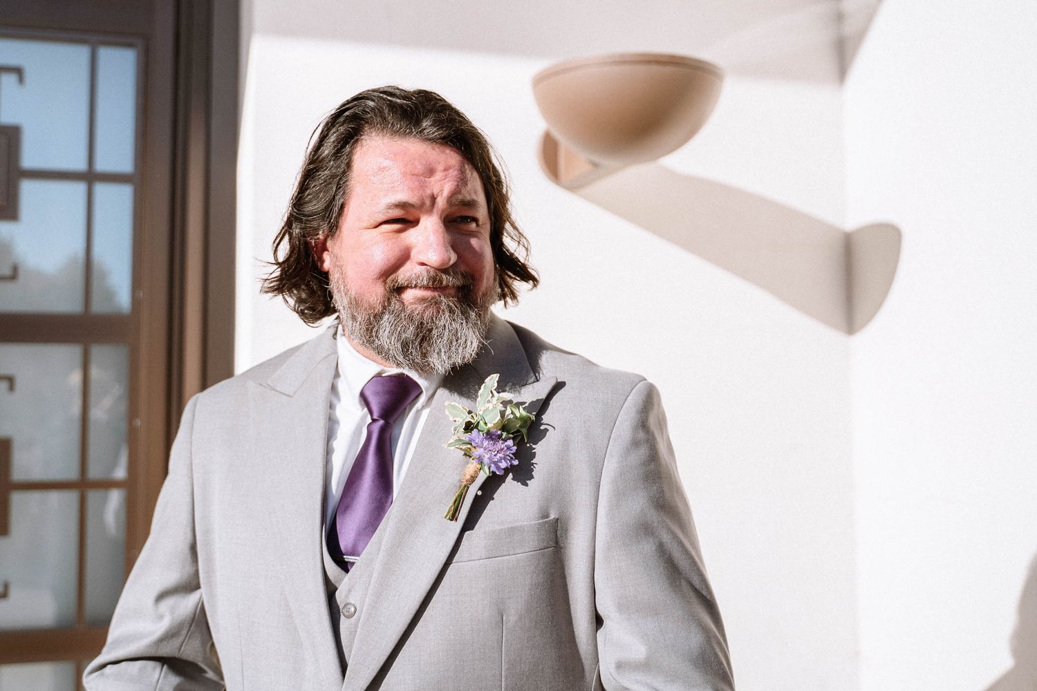 Groom portrait outside LDS temple in London during wedding day