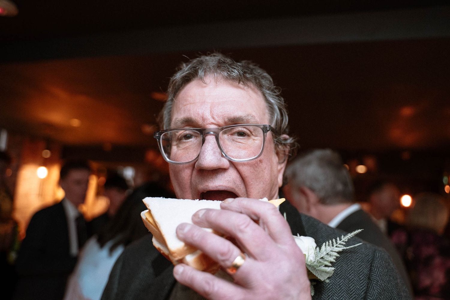 Wedding guest enjoying food at a belfast reception